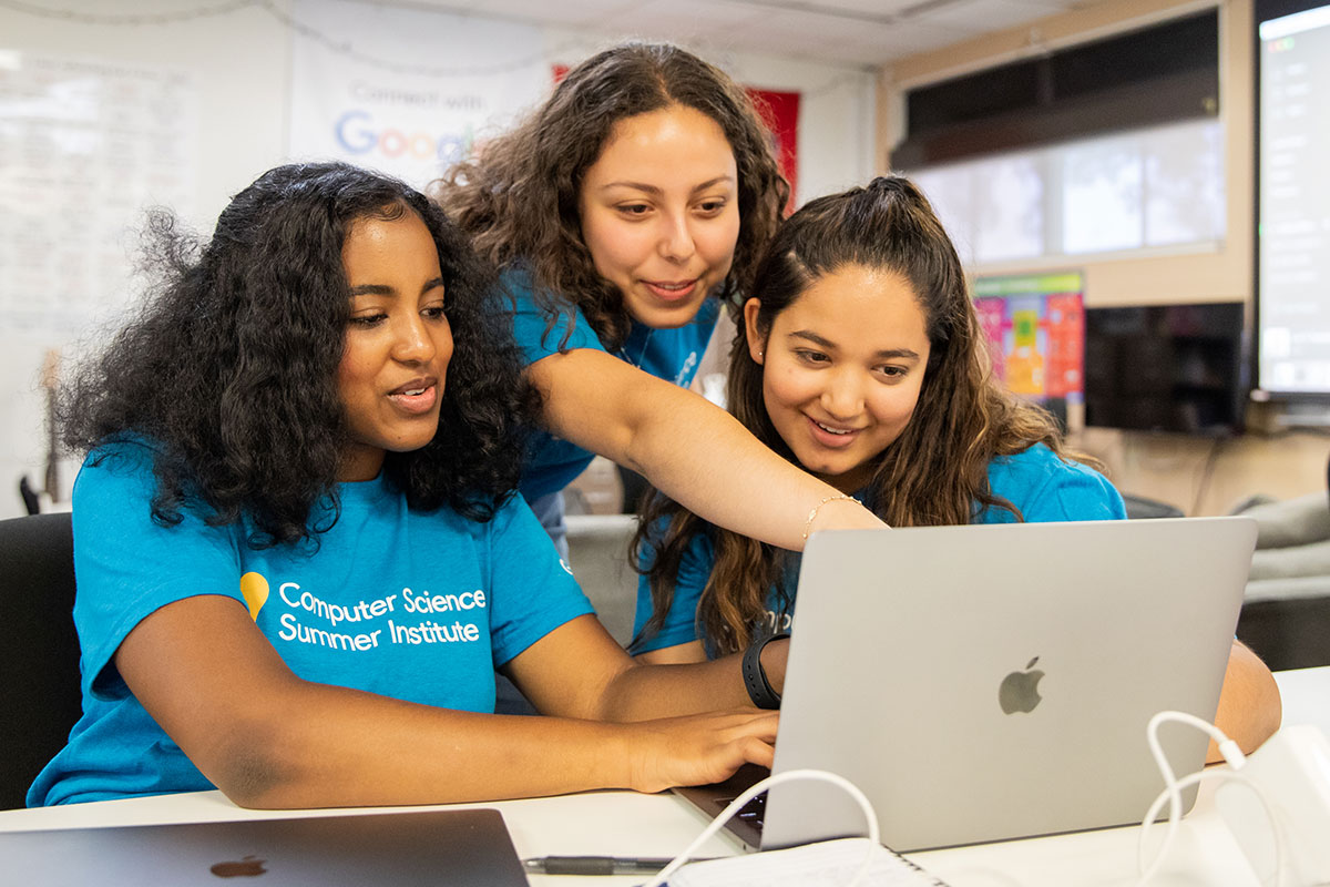 Students using a laptop to work on a project